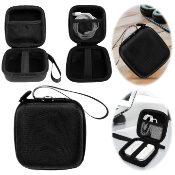 Compact black hard-shell travel case with inner divider and mesh pocket for storing earbuds and cables, with wrist strap.