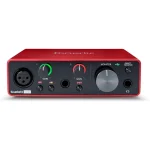 Front view of a red Focusrite Scarlett Solo audio interface with two gain knobs input jacks and monitor control on a dark panel | PricZone