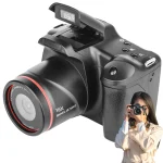 1080P 16MP Digital Camera with 16X Zoom and 24 Inch LCD 6 | PricZone Close up of a black digital camera with a large lens 16x digital zoom and a person holding a camera beside it indicating photography gear | PricZone