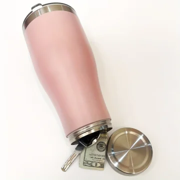 Close up of a pink stainless steel travel mug with a metal lid accompanied by keys and a folded $20 bill on a white background | PricZone