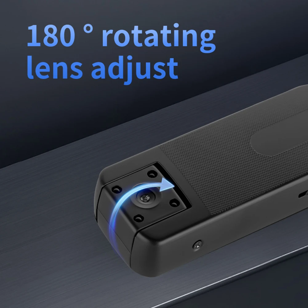 Close-up of a black camera accessory on a metallic surface, highlighting a 180° rotating lens adjust feature with a blue arrow indicating rotation.