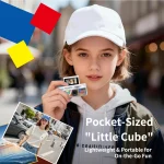 Girl in a white cap holding a pocket sized mini camera ad text promotes the Pocket Sized Little Cube for on the go fun | PricZone