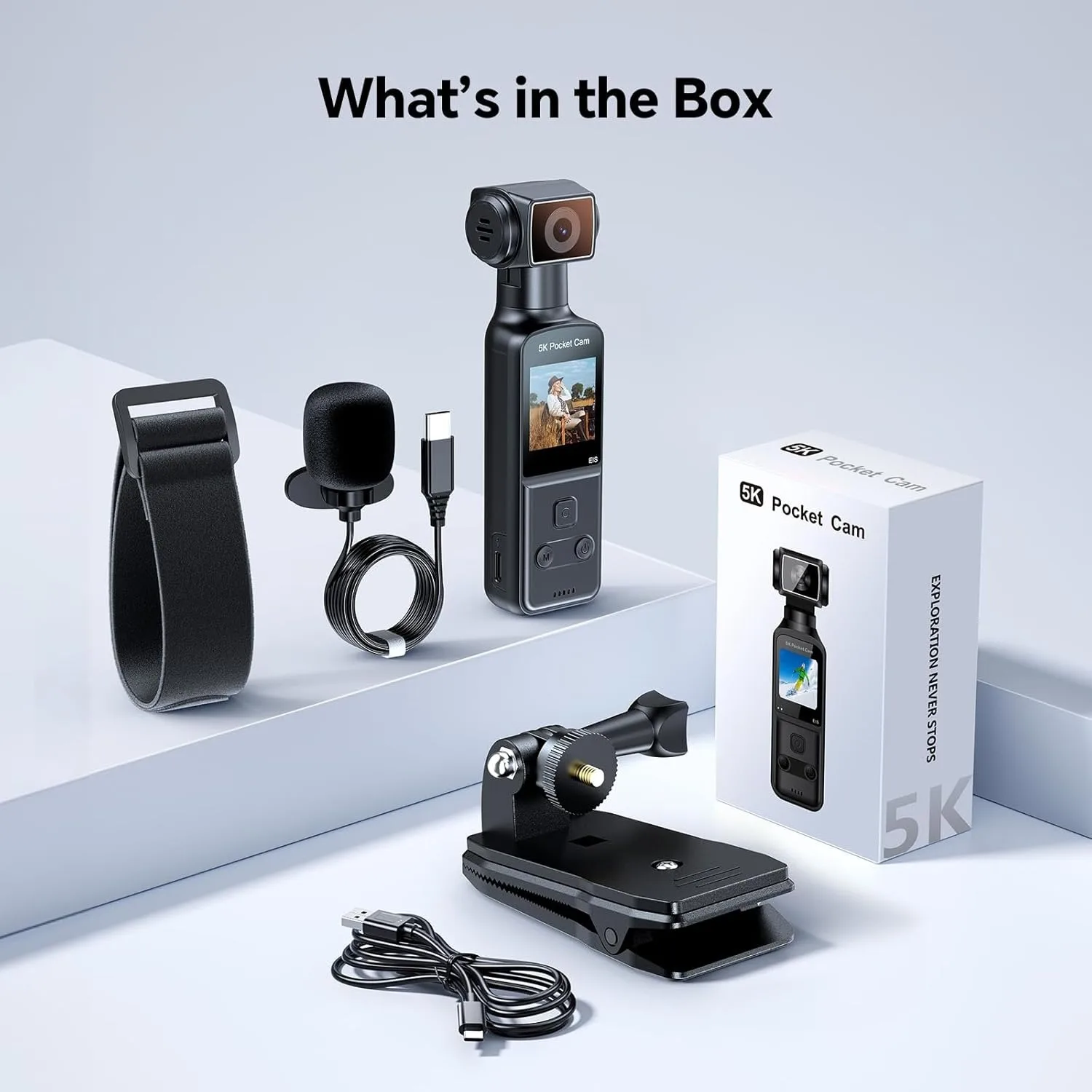 What’s in the Box: a 5K Pocket Cam with its screen, microphone, USB‑C cable, mount/stand, and the packaging box on a white display surface.