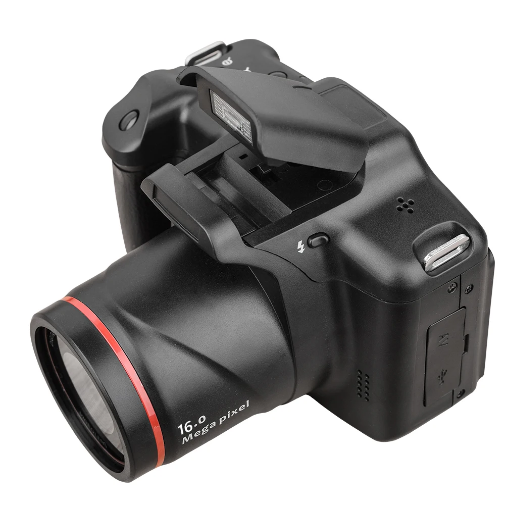 Black digital camera with a wide lens and a red ring, labeled 16.0 Mega Pixel, shown at an angle with a pop-up flash. 16.0 MP lens mark visible and lens extends outward.