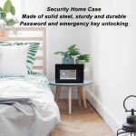 US Digital Electronic Safe Box Password Key Unlocking Home 5 | PricZone Black electronic safe with keypad and dial on a round bedside table beside a bed in a bright plant filled bedroom | PricZone