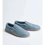 Light blue woven slip on sneakers with a brown sole on a light background | PricZone