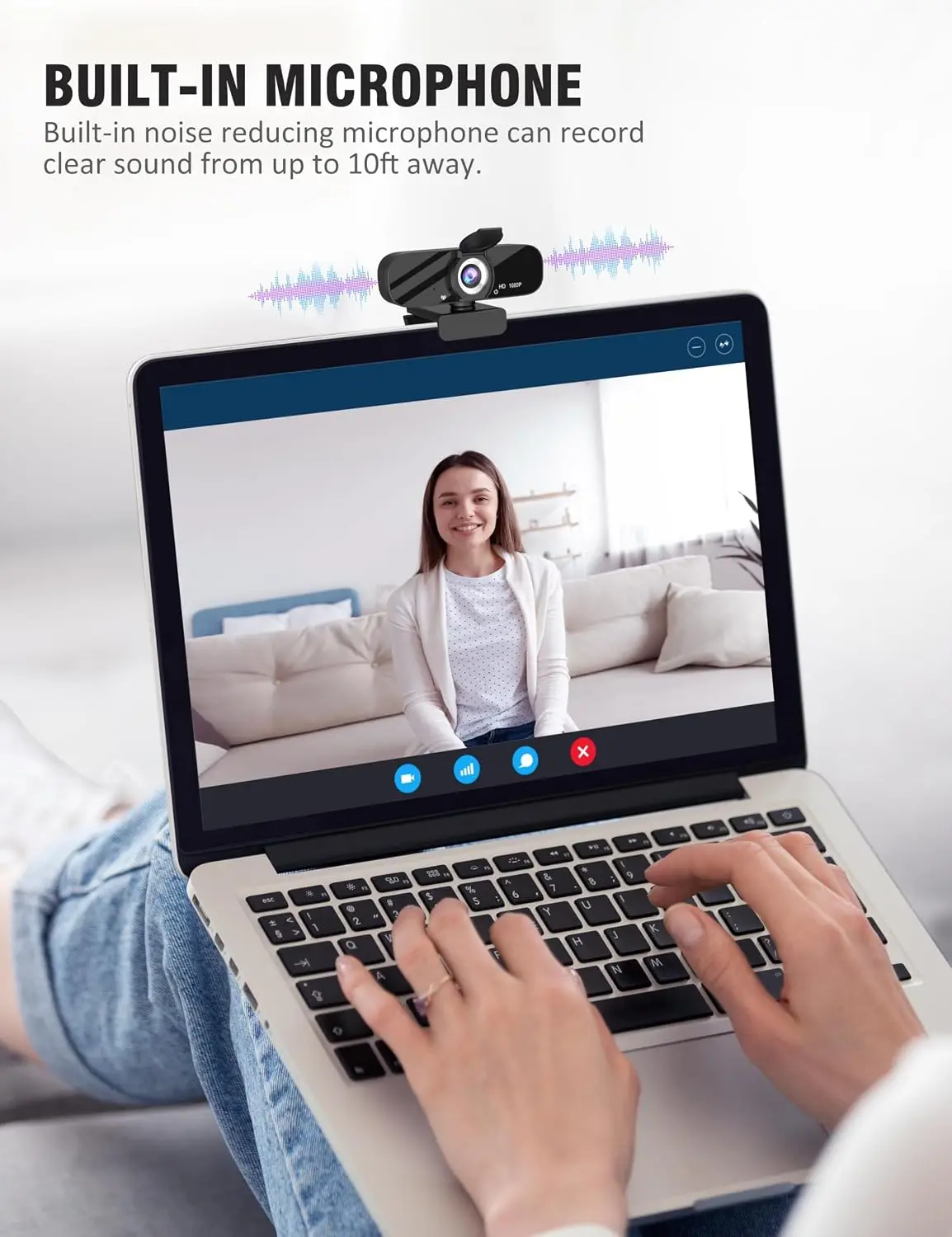 Video call on a laptop: smiling woman on screen, webcam mounted on top, with rounded call controls along the bottom edge of the window.