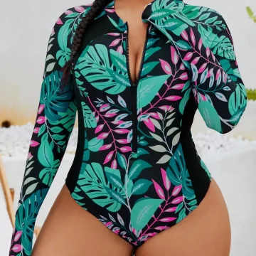 Woman in a tropical leaf print long sleeve zipper bodysuit with hoop earrings posed outdoors | PricZone