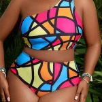 Plus Size Colorful OneShoulder Swimwear Set for Summer 5 | PricZone One shoulder multicolor geometric bikini top with matching high waisted bottoms worn outdoors among green plants with accessories like shells and bracelets | PricZone