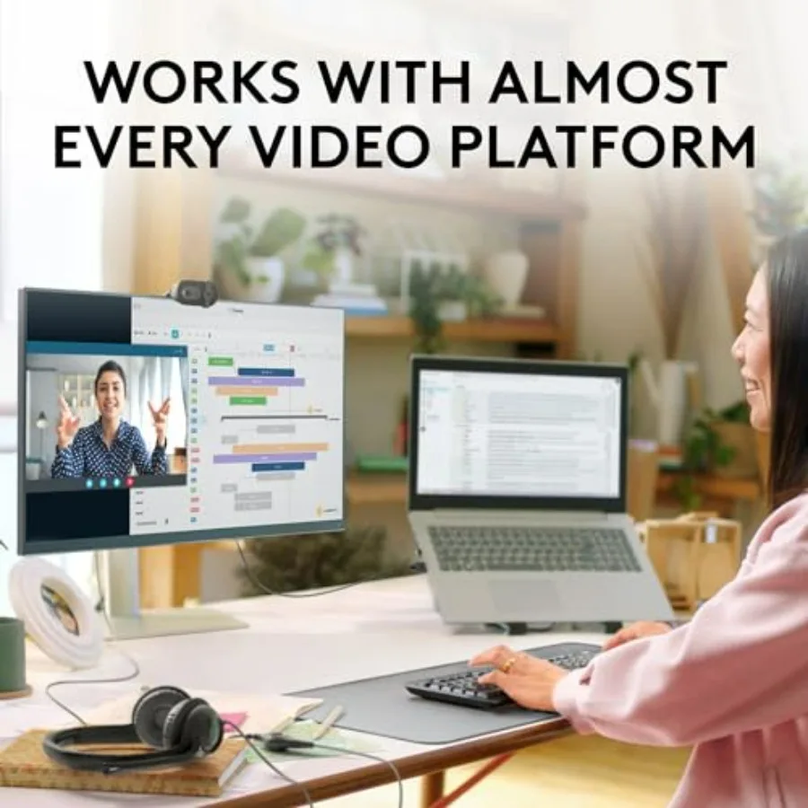 Woman at a desk using a computer setup (monitor and laptop) with the banner text “Works with almost every video platform.”