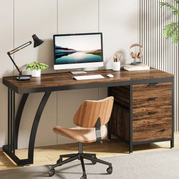Modern home office with a desktop computer on a wooden desk, an adjustable chair, lamp, and plant nearby.