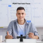 4K Webcam with 120° Wide Angle Pdaf Autofocus 4 | PricZone Man smiling at a webcam on a laptop demonstrating 4K PDAF fast auto focus | PricZone