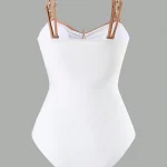 Minimalist White OnePiece Swimsuit with Metallic Beaded 1 | PricZone White bustier style top with tan dual straps and gold hardware on a gray background shown from the front on a mannequin torso | PricZone