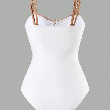 White bustier-style top with tan dual straps and gold hardware on a gray background, shown from the front on a mannequin torso