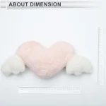Plush HeartShaped Car Neck Pillow with Winged Design Soft 6 | PricZone Soft pink plush heart with white fluffy wings on a white background with rulers shown for scale to indicate dimensions | PricZone