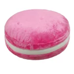 Pink round plush cushion with a white cream colored middle seam resembling a soft macaron pillow | PricZone