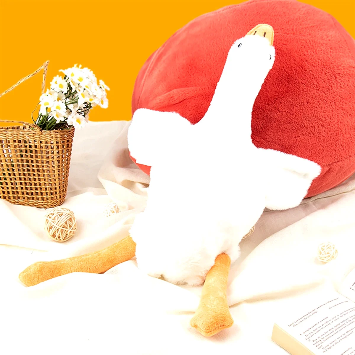 50Cm Goose Plush Toy Soft Stuffed Animal Couch Pillow Bed 5 | PricZone White plush figure in front of a large red heart shaped pillow on a bright orange background with a daisies basket nearby | PricZone