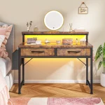 A makeup vanity with a round illuminated mirror on a wooden table makeup brushes perfume and vanity organizers against a beige wall | PricZone