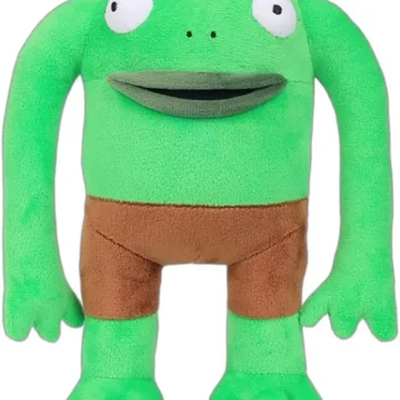 Green plush frog monster with long arms and brown shorts, smiling at the viewer, standing upright.