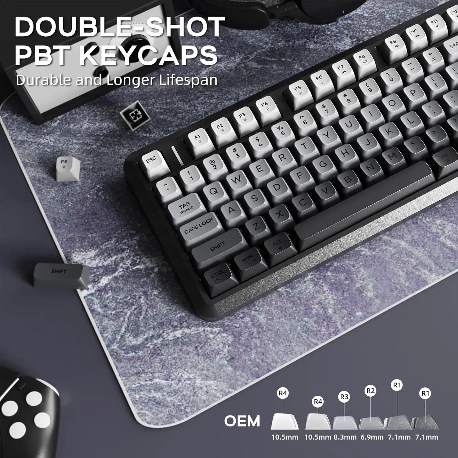 Attack Shark M75 Wireless Membrane Gaming Keyboard 6 | PricZone Close up of a mechanical keyboard with gray double shot PBT keycaps on a textured desk mat large white title reads DOUBLE SHOT PBT KEYCAPS and Durable and Longer Lifespan with OEM and key size details at the bottom indicating a product showcase | PricZone