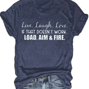 Navy heather T-shirt with white printed quote: “Live, Laugh, Love. If that doesn’t work, load, aim & fire.” worn with distressed jeans