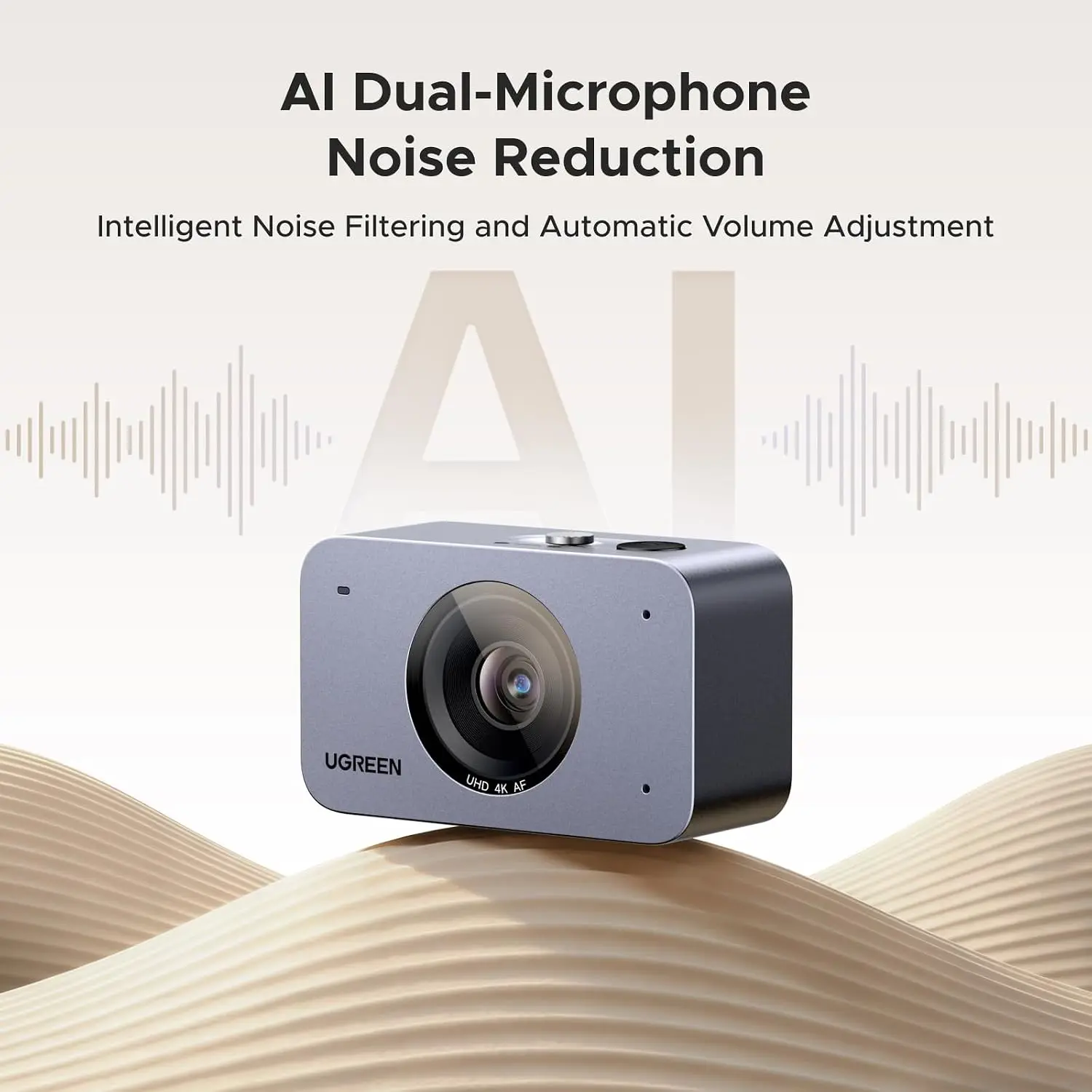 UGREEN AI dual-microphone noise reduction device displayed on sand dunes with a waveform background, highlighting the product concept