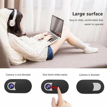 Person lounging on a sofa wearing headphones and typing on a laptop on her lap, with a soft, cozy setting and a product tagline about a 'Large surface'.