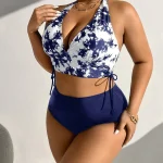 Plus Size Tie Dye Halter Neck Bikini Set for Beach Swimwear 5 | PricZone Woman wearing a blue and white halter bikini top with navy bottoms posing against a light wall | PricZone