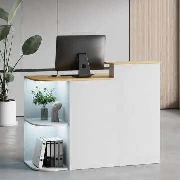 Modern white reception desk with a wooden top and a computer monitor plus open illuminated shelves holding a plant and organized binders | PricZone