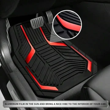 Black car floor mat with red illuminated accents and a textured tread pattern; close-up shows layered surface detail.